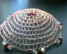 Load image into Gallery viewer, Rose God wire kippah with dark pinkish  beads and translucent aurora borealis glass beads. A single pinkish red glass bead rsts at the focal, much like the it at the heart of a cherry.