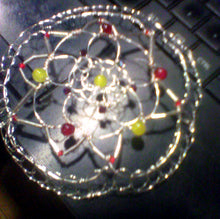 Load image into Gallery viewer, Daffodil yellow and tulip inspired colors of Czech glass beads on  silver bugle beads and silver wireform this nature inspired kippah. Shown on a computer keyboard.