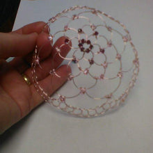 Load image into Gallery viewer, Garnet and pink beaded  wire kippah beng held against a white backdrop