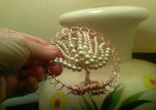 Load image into Gallery viewer, Closeup of Pearl TOL against floral lamp
