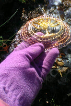 Load image into Gallery viewer, Silver, light and dark copper, gold and rose wire crochet supports glass beaded Tree of Life.  A purple gloved hand is holding the kippah against a background of light snow and golden leaves.