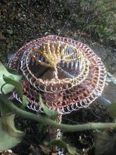 Load image into Gallery viewer, Tree of Life beaded wiire kippah shown on a wire railing with vines in the foreground and background.d