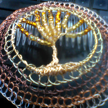 Load image into Gallery viewer, Closeup of handmade beaded wire tol kippah on computer