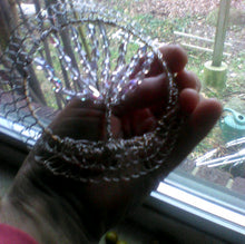 Load image into Gallery viewer, Crystal and Silver tol held in sunny wndow