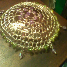 Load image into Gallery viewer, Sprng Colors Purple and green beaded kippah with purple dangles resting on brown table. There are file folders in the background.