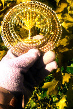 Load image into Gallery viewer, In the morning light, the beads looked almost the same color as the fallen leaves!