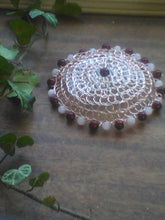 Load image into Gallery viewer, Dark pink and light pink beaded wire kippah  on desk, with green vine on the left