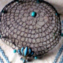 Load image into Gallery viewer, Closeup of black wire kippah with turquoise beading and fleur-de lis charm