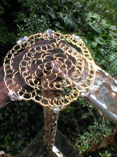 Load image into Gallery viewer, Gold and Pink Beaded Wire Kippah  on railing, with green plants in the background