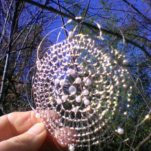 Load image into Gallery viewer, kippah being held up to a blue sky
