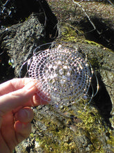 Load image into Gallery viewer, pearl, crystal and silver kippah being held in front of tree trunk
