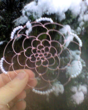 Load image into Gallery viewer, Rose gold and pearl kippah being held against snowy tree