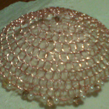 Load image into Gallery viewer, Closeup of rose gold wire kippah with peachy pink crystals and pearls on whie cloth