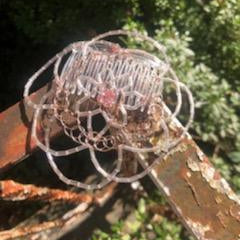 Decorative rose wire kippah with crystals and glass beading on vintage railing.