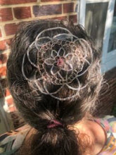 Load image into Gallery viewer, Person with decorative hair piece/kippah/yarmulke against a brick wall
