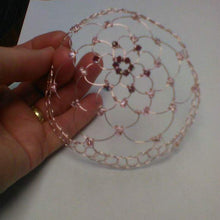Load image into Gallery viewer, Garnet and pink beaded  wire kippah beng held against a white backdrop
