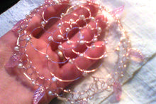 Load image into Gallery viewer, Shechinah wings kippah, resting on a hand that has a gold wedding ring. The kippah is made from rose gold wire, a moonstone focal,real freshwater pearls, translucent pink glass wings, and silver bugle beads. a comb or clips will be added upon request.
