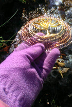 Load image into Gallery viewer, Silver, light and dark copper, gold and rose wire crochet supports glass beaded Tree of Life.  A purple gloved hand is holding the kippah against a background of light snow and golden leaves.    

