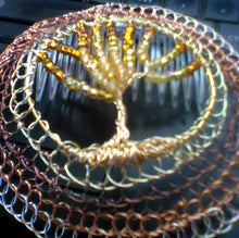 Load image into Gallery viewer, Closeup of handmade beaded wire tol kippah on computer
