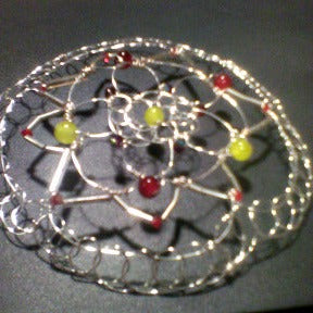 Daffodil yellow and tulip inspired colors of Czech glass beads on  silver bugle beads and silver wire form this nature inspired kippah.
