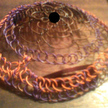 Load image into Gallery viewer, Brown, purple and orange coated copper wire is repurposed for a kippah 
