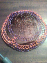 Load image into Gallery viewer, Brown, purple and orange coated copper wire is repurposed for a kippah 
