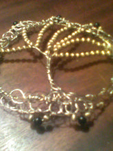 Load image into Gallery viewer, This TOL Kippah is made from silver and gold wire, and repurposed gold and black beads from necklaces.
