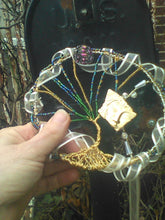 Load image into Gallery viewer, Tree of Life Wall Hanging being held against black mailbox
