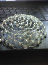 Load image into Gallery viewer, Crystal and pearl kippah  siting on a computer keyboard.
