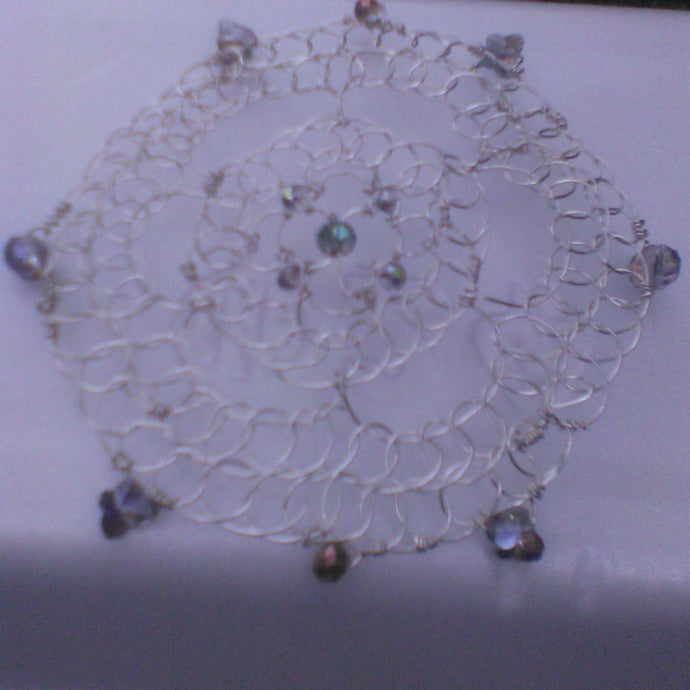 Silver wire with iridescent silver crystals and butterflies. 