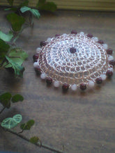Load image into Gallery viewer, Dark pink and light pink beaded wire kippah  on desk, with green vine on the left
