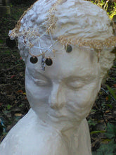 Load image into Gallery viewer, Front view of headdress on statue.

