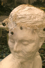 Load image into Gallery viewer, Front of headdress on statue.
