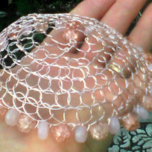 Load image into Gallery viewer, Peach and pink beaded wire kippah being held
