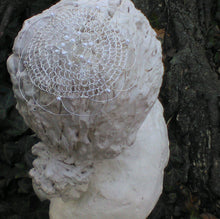 Load image into Gallery viewer, silver, pearl and crystal kippah on statue on top  of tree trunk
