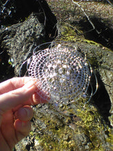 Load image into Gallery viewer, pearl, crystal and silver kippah being held in front of tree trunk
