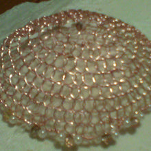 Load image into Gallery viewer, Closeup of rose gold wire kippah with peachy pink crystals and pearls on whie cloth
