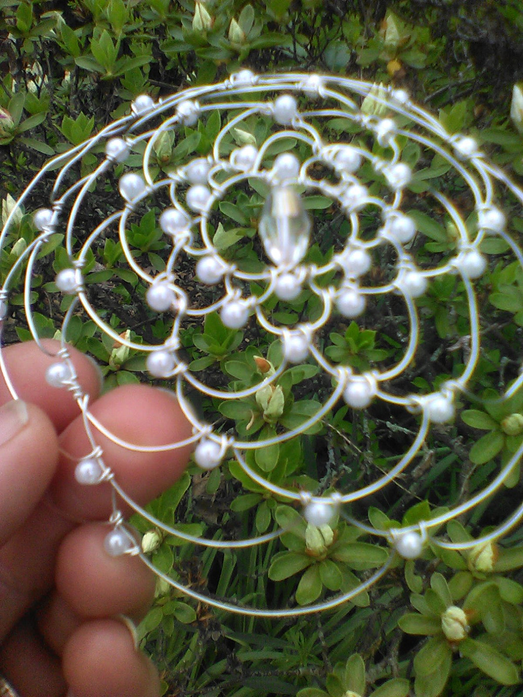 Silver  wire kippah with pearl beading and crystal  bead in the center.